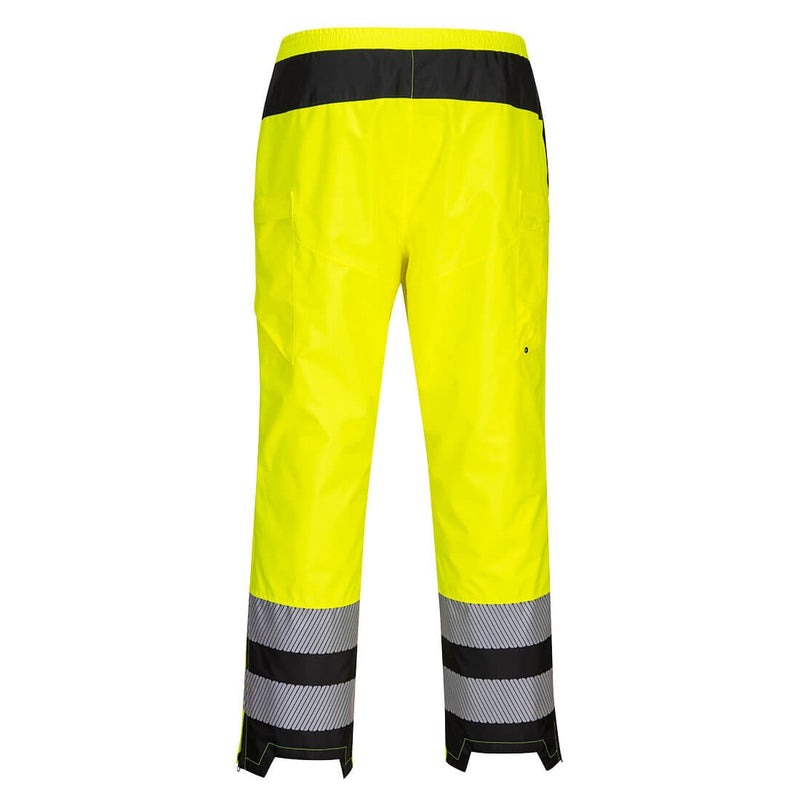 Back view of women’s yellow and black Class E rain pants with segmented reflective bands