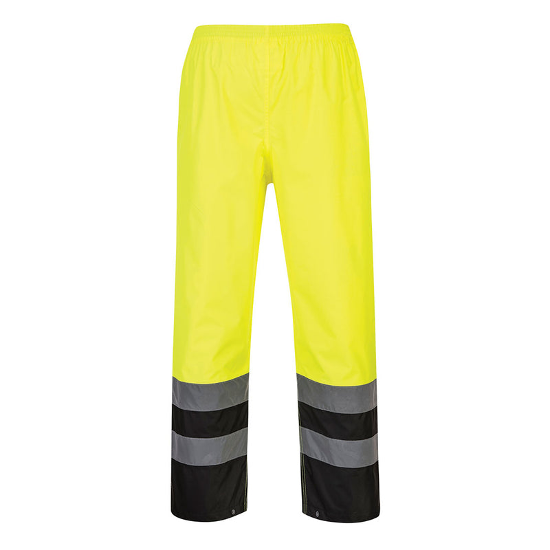 Back view of yellow and black Class E rain pants with reflective leg bands