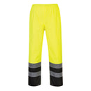 Back view of yellow and black Class E rain pants with reflective leg bands