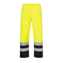 Front view of yellow and black Class E rain pants with reflective leg bands